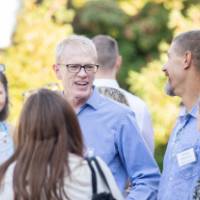 faculty chatting outside